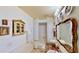Cozy bathroom featuring a red marble countertop and ornate gold framed mirror at 625 Woodlawn Cemetery Rd, Gotha, FL 34734