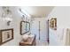 Bright bathroom with marble top vanity and sink, large designer mirror and updated lighting at 625 Woodlawn Cemetery Rd, Gotha, FL 34734