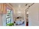 Elegant bathroom featuring a clawfoot tub, vintage-style fixtures, and a stained-glass window at 625 Woodlawn Cemetery Rd, Gotha, FL 34734