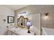 Bathroom with vanity, designer mirror and lighting, and elegant wall decor at 625 Woodlawn Cemetery Rd, Gotha, FL 34734