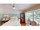 Charming bedroom with natural light and views to a lush backyard at 625 Woodlawn Cemetery Rd, Gotha, FL 34734
