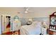 Charming bedroom featuring hardwood floors, an updated ceiling fan, and classic decor at 625 Woodlawn Cemetery Rd, Gotha, FL 34734