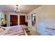 Charming bedroom with chandelier lighting and a view of the spiral staircase at 625 Woodlawn Cemetery Rd, Gotha, FL 34734