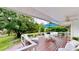 Spacious wooden deck with outdoor dining and lounging furniture overlooking the backyard at 625 Woodlawn Cemetery Rd, Gotha, FL 34734
