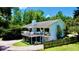 Charming two-story home with a spacious deck, lovely landscaping, and circular brick driveway at 625 Woodlawn Cemetery Rd, Gotha, FL 34734