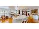 Spacious kitchen with white cabinets, hardwood floors, a center island with seating, and modern appliances at 625 Woodlawn Cemetery Rd, Gotha, FL 34734