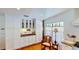 Cozy kitchen with custom cabinetry, window views, and wooden floors offers both charm and functionality at 625 Woodlawn Cemetery Rd, Gotha, FL 34734