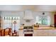 Charming kitchen featuring custom cabinetry, butcher block countertops, and stainless steel appliances at 625 Woodlawn Cemetery Rd, Gotha, FL 34734