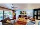 Open living room with outdoor views from the sliding glass door at 625 Woodlawn Cemetery Rd, Gotha, FL 34734