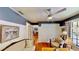 Inviting living room with neutral paint, hardwood floors, and an open floor plan to the dining area at 625 Woodlawn Cemetery Rd, Gotha, FL 34734