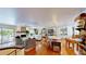 Bright open floor plan with hardwood floors, fireplace, modern furnishings, and access to a large outdoor deck at 625 Woodlawn Cemetery Rd, Gotha, FL 34734