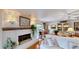 Inviting living room with a fireplace, hardwood floors, and ample natural light at 625 Woodlawn Cemetery Rd, Gotha, FL 34734