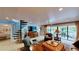 Spacious living room features a spiral staircase and access to the outdoor deck at 625 Woodlawn Cemetery Rd, Gotha, FL 34734