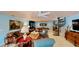 Relaxing living room with spiral staircase, built-in bar area, billiard table, and comfortable seating arrangements at 625 Woodlawn Cemetery Rd, Gotha, FL 34734