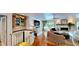Wide view of the living room featuring a fireplace, entertainment center, and staircase at 625 Woodlawn Cemetery Rd, Gotha, FL 34734
