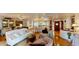 Open-concept living area with hardwood floors seamlessly connecting to a bright, spacious kitchen at 625 Woodlawn Cemetery Rd, Gotha, FL 34734