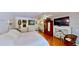 Relaxing main bedroom features a ceiling fan, hardwood floors and ornate fireplace at 625 Woodlawn Cemetery Rd, Gotha, FL 34734