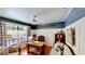 Stylish office with hardwood floors, classic dark paint, and vintage décor at 625 Woodlawn Cemetery Rd, Gotha, FL 34734
