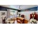 Cozy office features wood floors, a vintage desk, and natural light at 625 Woodlawn Cemetery Rd, Gotha, FL 34734