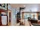 View of the spiral staircase as it enters into the living room at 625 Woodlawn Cemetery Rd, Gotha, FL 34734