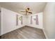Bright bedroom featuring hardwood-style flooring, and lots of natural light at 6310 Lake Underhill Rd, Orlando, FL 32807