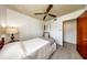 Bedroom with wood floors, a ceiling fan, and built in cabinets at 6310 Lake Underhill Rd, Orlando, FL 32807