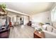 Bright living room with modern flooring, neutral walls, and comfortable seating area at 6310 Lake Underhill Rd, Orlando, FL 32807