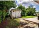 Backyard shed with double doors and ladder, providing extra storage and utility at 6310 Lake Underhill Rd, Orlando, FL 32807