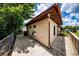 Side view of the home featuring a wooden deck, concrete walkway and storage shed at 6310 Lake Underhill Rd, Orlando, FL 32807