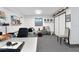 Finished basement with neutral carpet, decor, and ample storage space at 65 Oakdale St, Windermere, FL 34786