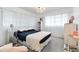 Cozy bedroom featuring a chandelier, a soft color palette, and comfortable decor at 65 Oakdale St, Windermere, FL 34786