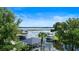 Scenic lake view featuring boat docks and lush greenery under a bright blue sky at 65 Oakdale St, Windermere, FL 34786