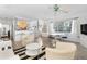 Bright living room featuring an open floor plan, modern decor, and ample natural light at 65 Oakdale St, Windermere, FL 34786