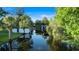 Scenic waterway with lush greenery and various boat docks and houses along the shoreline at 65 Oakdale St, Windermere, FL 34786