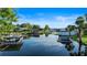 Picturesque waterfront view with multiple boat docks and serene water reflections at 65 Oakdale St, Windermere, FL 34786