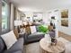 Open-concept living space with a combined living room and kitchen area featuring contemporary design at 651 Pennywort St, Lake Alfred, FL 33850
