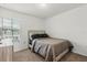 Bedroom with a bed, carpet flooring, natural light, and neutral decor at 827 Grandin St, Davenport, FL 33837