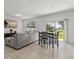 Bright living area featuring a sliding glass door and an open dining area at 827 Grandin St, Davenport, FL 33837
