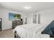 Main bedroom featuring a queen-sized bed, dresser, TV and neutral decor at 827 Grandin St, Davenport, FL 33837