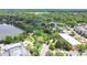 Gorgeous aerial view showcasing the community's lake with fountain and lush landscaping at 900 Northern Dancer Way # 204, Casselberry, FL 32707