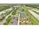 Aerial shot of community park featuring playground, pump track, and open green spaces at 900 Northern Dancer Way # 204, Casselberry, FL 32707