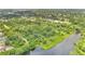 An aerial view of the community, showing a lake surrounded by lush greenery at 900 Northern Dancer Way # 204, Casselberry, FL 32707