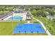 A birds eye view showcases the pool and basketball court within the community at 900 Northern Dancer Way # 204, Casselberry, FL 32707