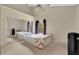 Bright bedroom features neutral walls, plush carpet, ceiling fan, and mirrored closet doors at 900 Northern Dancer Way # 204, Casselberry, FL 32707