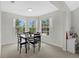 Cozy dining room with ample natural light, featuring a modern table setting for comfortable meals at 900 Northern Dancer Way # 204, Casselberry, FL 32707