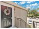 Welcoming entrance featuring a decorative wreath on the front door and stairs leading to the unit at 900 Northern Dancer Way # 204, Casselberry, FL 32707