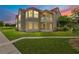 Charming condo featuring a red tile roof, well-maintained lawn, and a screened porch, perfect for relaxing outdoors at 900 Northern Dancer Way # 204, Casselberry, FL 32707