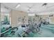 Well-equipped gym with weights, machine, and multiple mirrors for a comprehensive workout experience at 900 Northern Dancer Way # 204, Casselberry, FL 32707