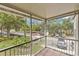 Screened patio area with a scenic view of a parking lot and mature trees at 900 Northern Dancer Way # 204, Casselberry, FL 32707