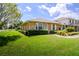 Charming home with manicured lawn, established shrubbery, and inviting walkway at 901 Illinois Ave, St Cloud, FL 34769